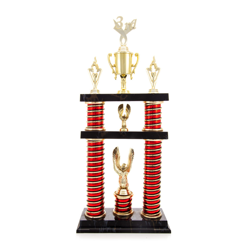 A large two tier trophy with gold components and red risers